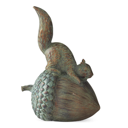 Bronze (copper patina) sculpture of a squirrel on a pine cone on a white background