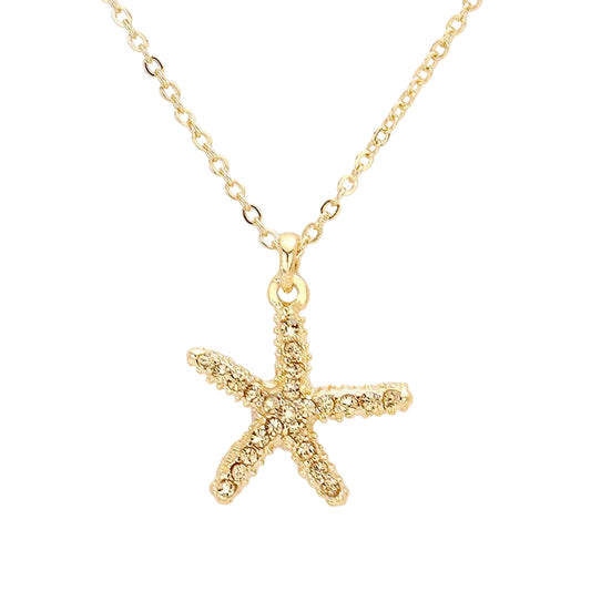 A gold-colored beaded starfish pendant necklace on a white background.