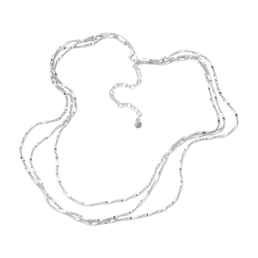 A silver-toned multi-strand chain necklace with a textured twisted link design and a small round charm, displayed on a clean white background.