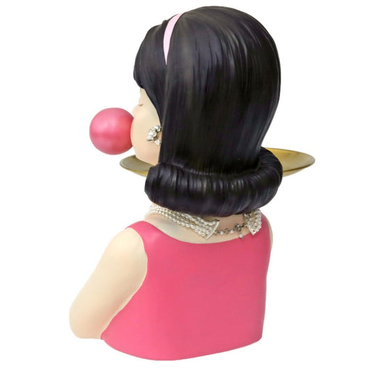 Bubblegum Girl with Gold Serving Tray Big Bubble and Gum - Woman Wearing pink top, a pearl necklace and earrings, black bouffant hair