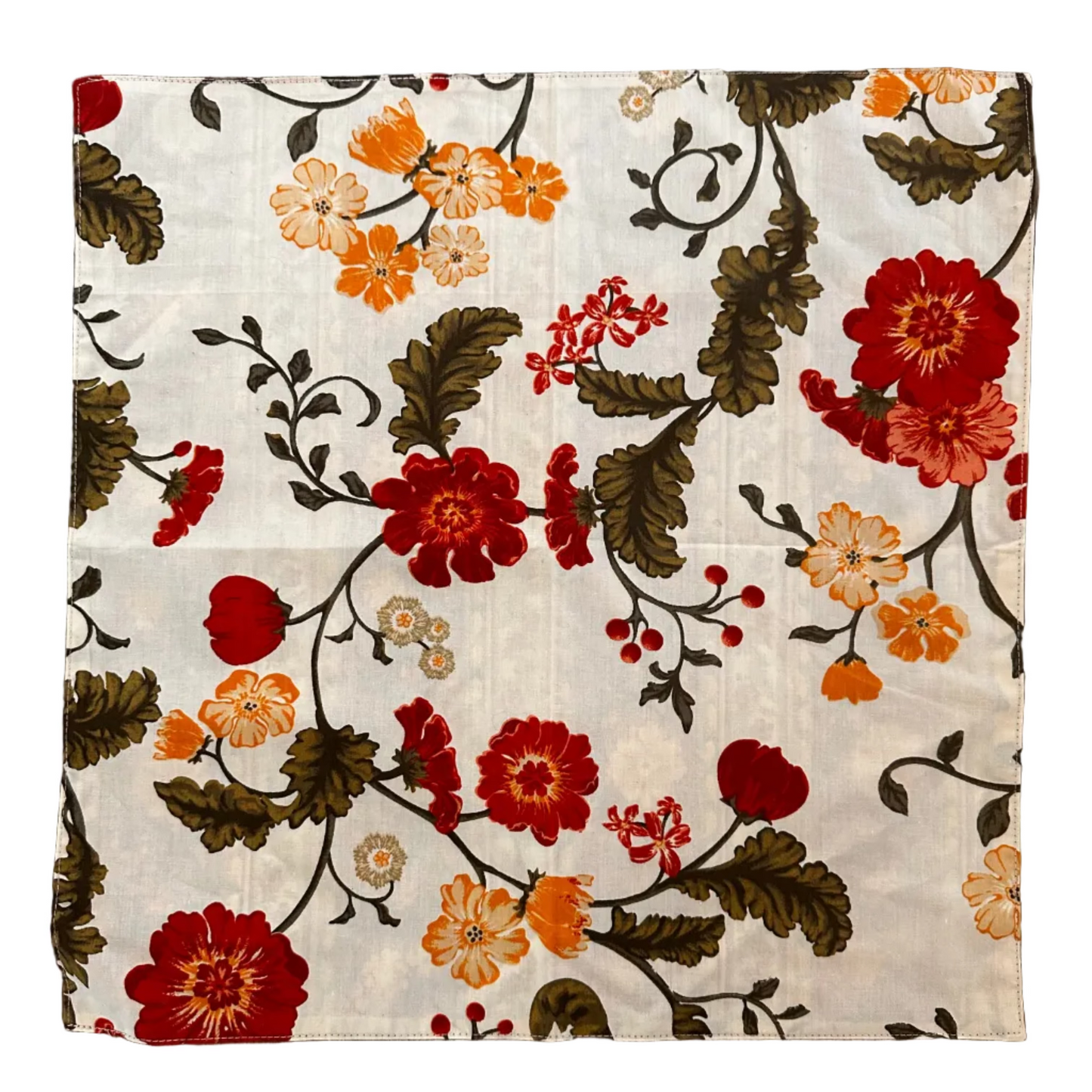 A square fabric napkin featuring a vintage floral pattern with red, orange, and cream flowers on a white background
