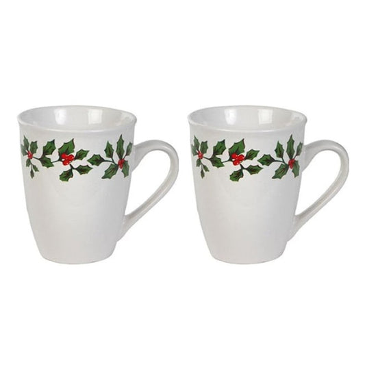 Two white mugs with holly design on a white background