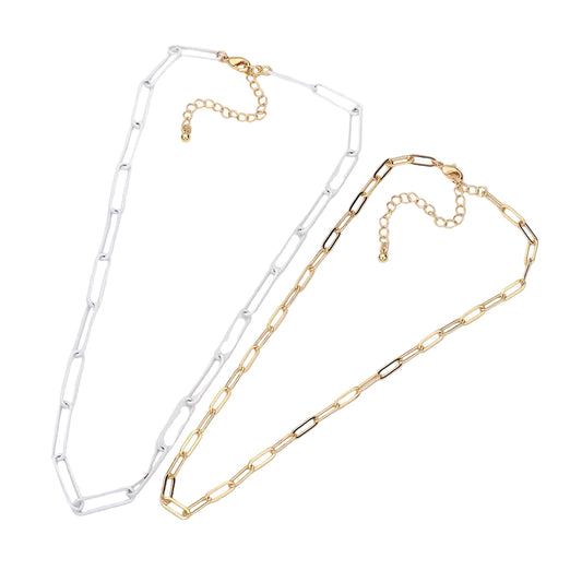 Two paperclip chain necklaces, one in white and one in gold, displayed on a clean white background.