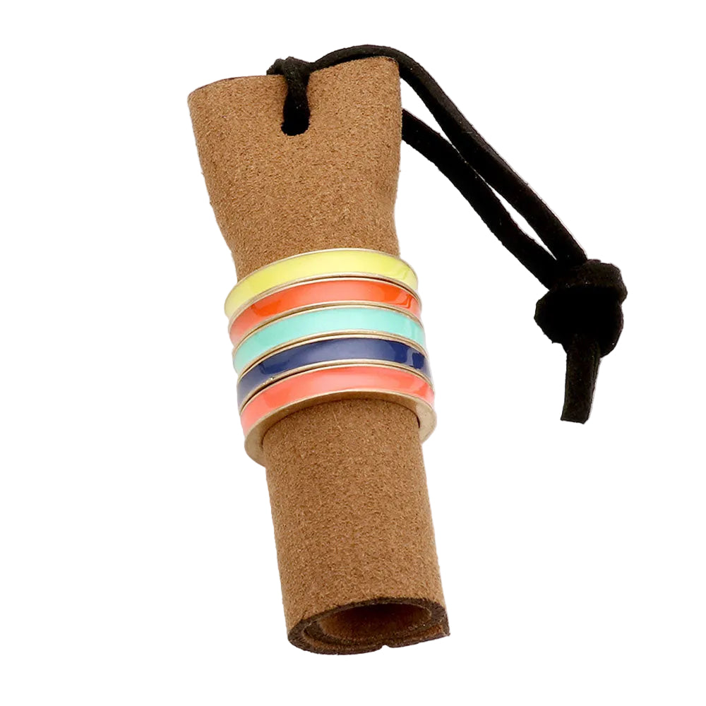 A set of five color stackable rings on a cork board, with each ring in different colors such as coral, mint, multi, and gold.