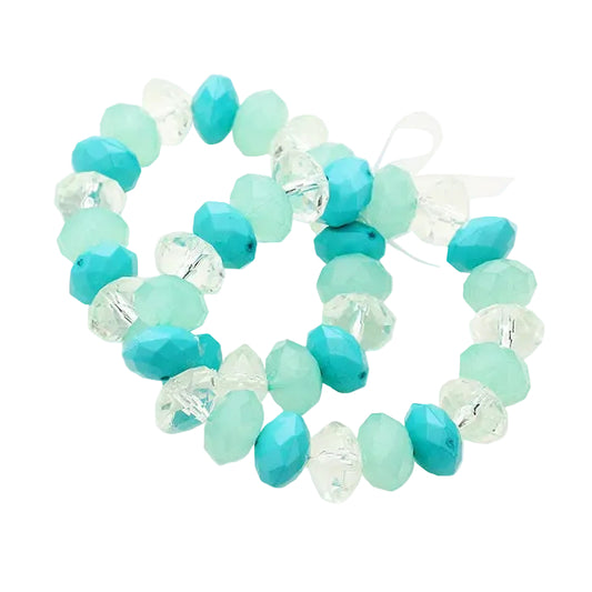 Turquoise and clear beaded bracelet on a light gray background