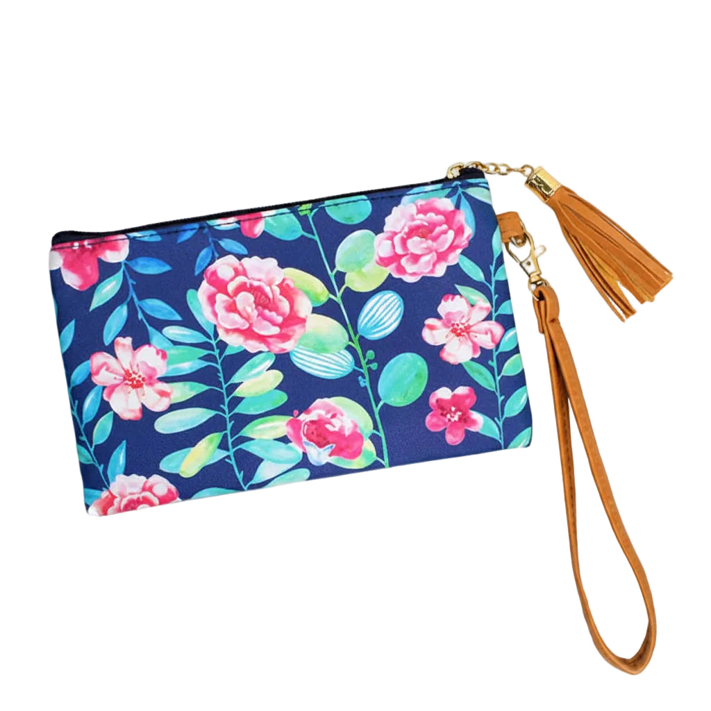 A floral wristlet clutch bag with a blue background featuring pink and green flowers, with a brown wristlet strap and gold-colored zipper.