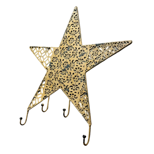 A rustic metal, distressed mustard star-shaped wall hook with a punched pattern, against a white background.