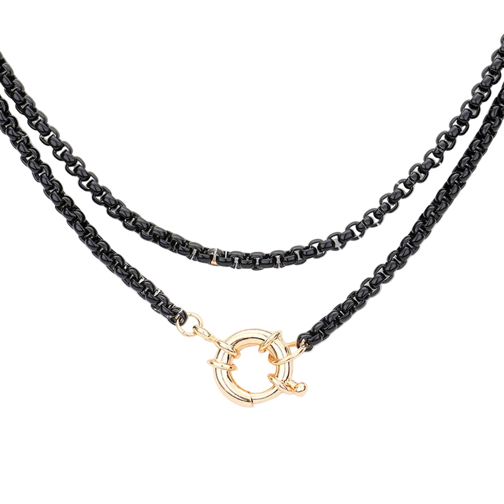 A double-strand black chain necklace with a gold-tone circular toggle clasp, displayed against a solid white background.