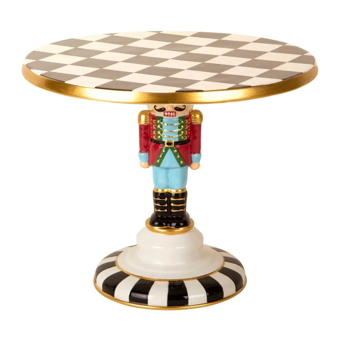 Whimsical nutcracker cake stand with a black and white checkered top, colorful details and gold accents. A festive pedestal server for Christmas treats.