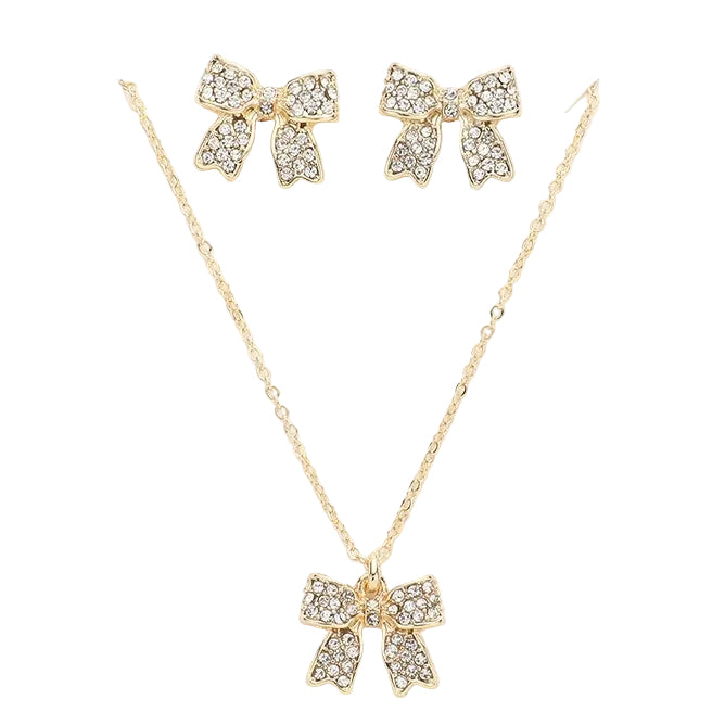 Gold bow-shaped necklace and earrings on a white background