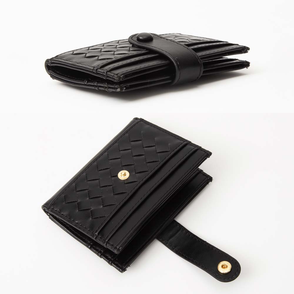 Two black woven wallets with gold accents on a white background