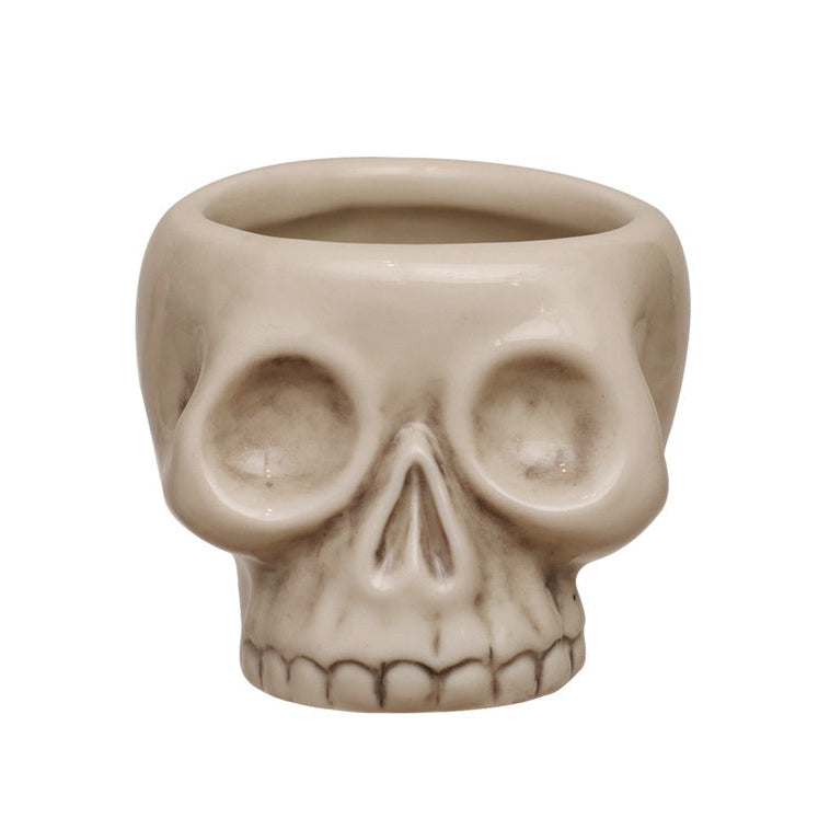 Stoneware skull-shaped toothpick holder with an antique bone finish for Halloween, gothic décor, or everyday tabletop use.