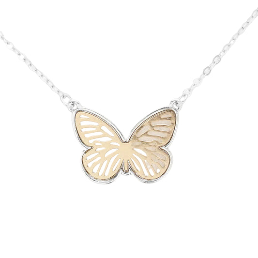 A delicate butterfly pendant necklace featuring a two-tone design with a textured gold center and silver filigree wings, suspended from a fine silver chain against a solid white background.