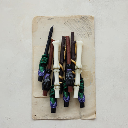 Collection of decorative sticks on a textured surface
