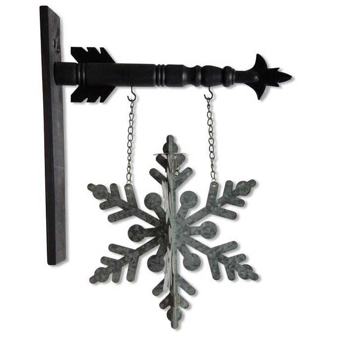 A metal double-sided 3-D snowflake arrow replacement sign for seasonal wall decor.