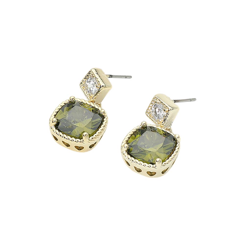 Gold earrings with green gemstones on a white background