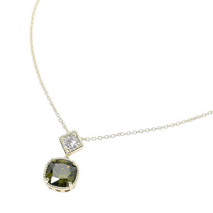 Necklace with a green gemstone pendant on a white background