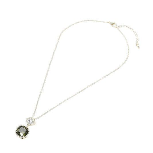 Necklace with a pendant featuring a green gemstone and clear crystal on a white background