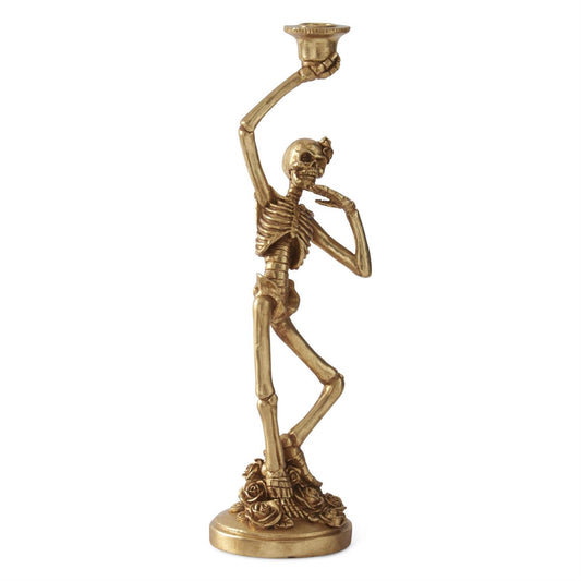 Gold skeleton candle holder on a white background