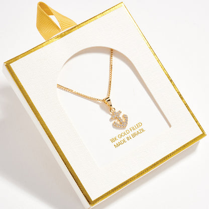 Gold necklace with anchor pendant in a decorative box