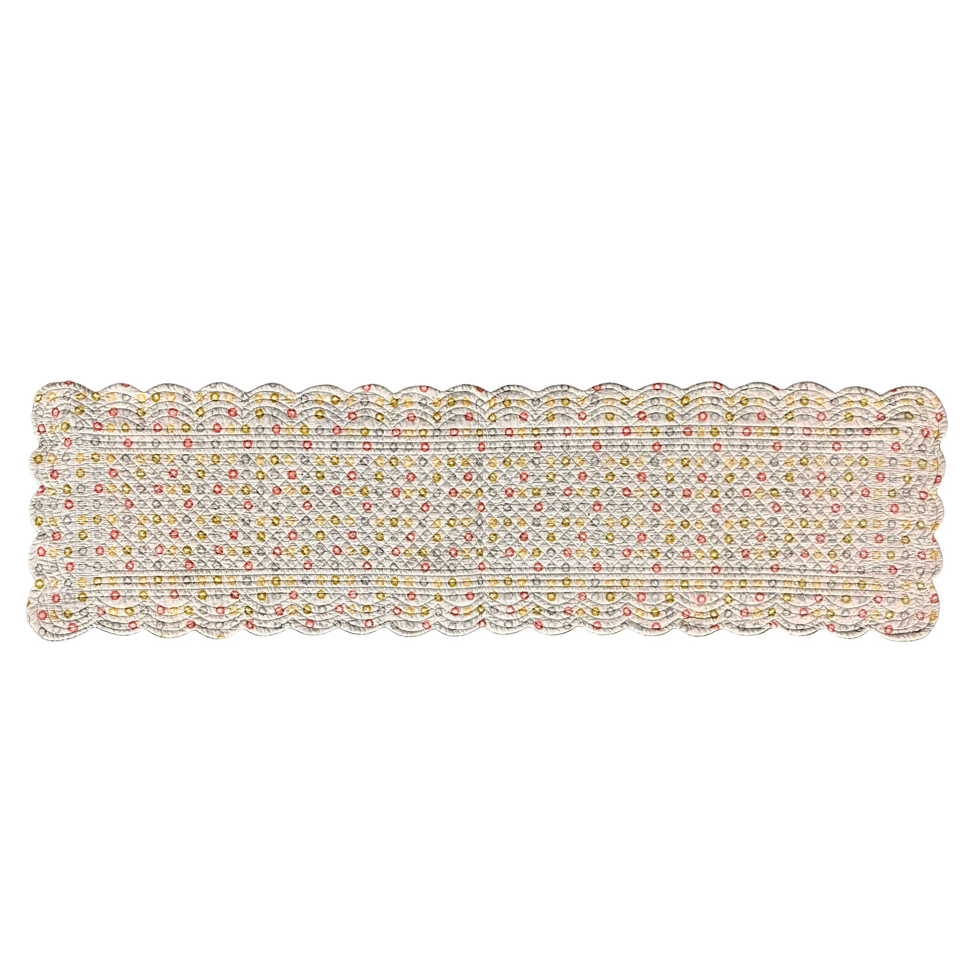A rectangular scalloped table runner with colorful polka dots a white background.