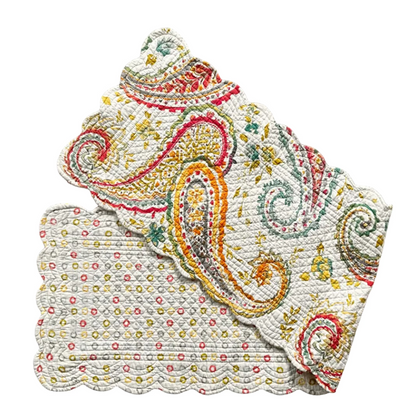 Decorative table runner with scalloped edges. One side features a small multicolor floral pattern on a cream background, and the other features a larger paisley pattern in orange, red, green, and blue on a cream background.
