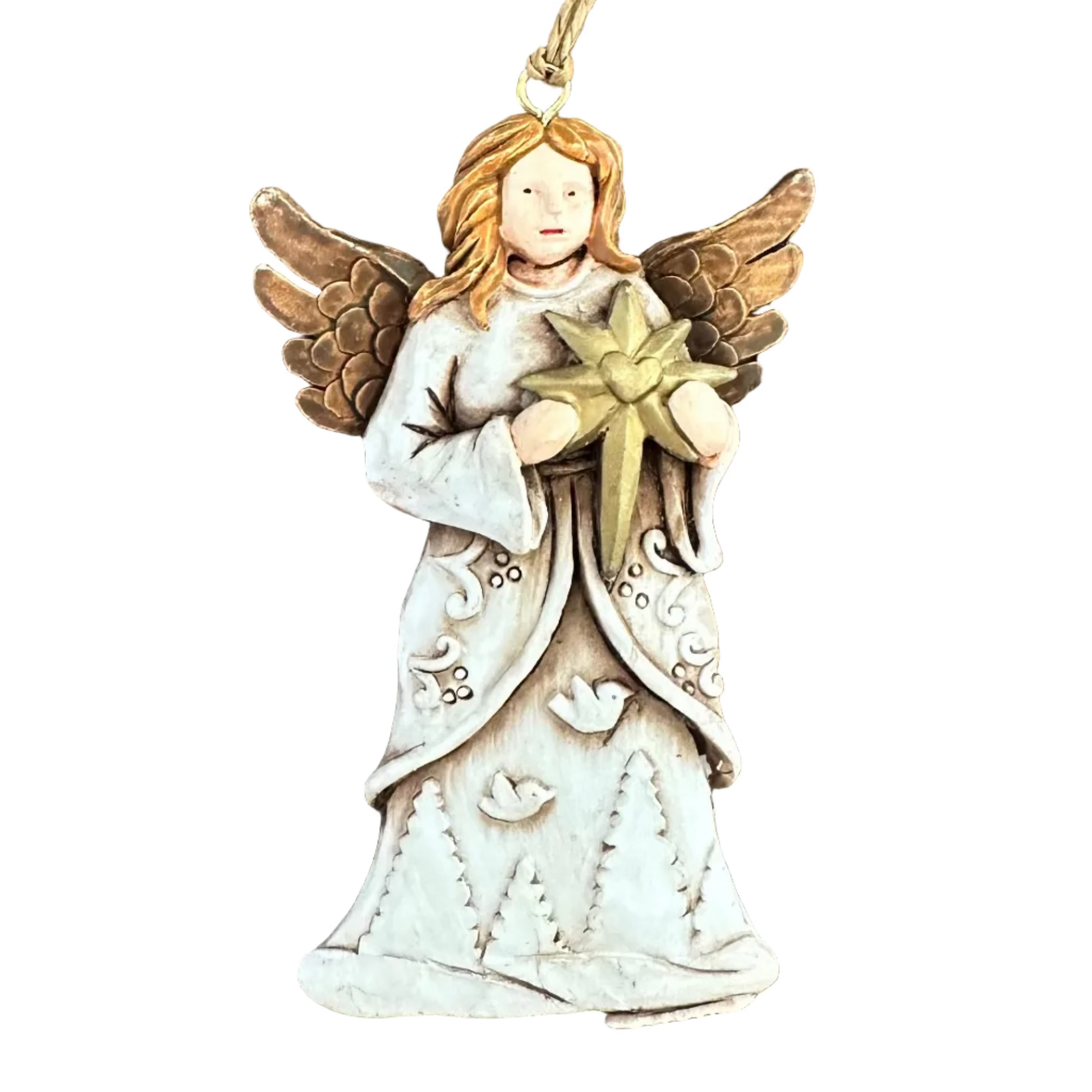 An angel Christmas ornament with a white gown, gold wings, and a gold star, resting on a white surface.