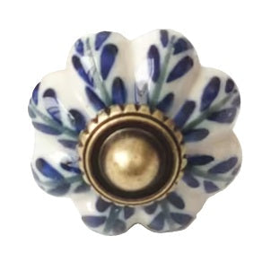 Decorative ceramic knob with blue floral pattern on a white background