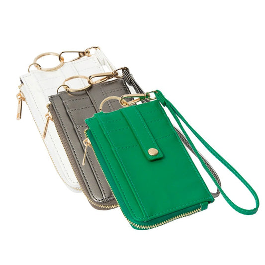 Three wallets (white, bronze, and green) with a strap on a white background