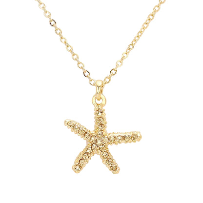A gold-colored beaded starfish pendant necklace on a white background.