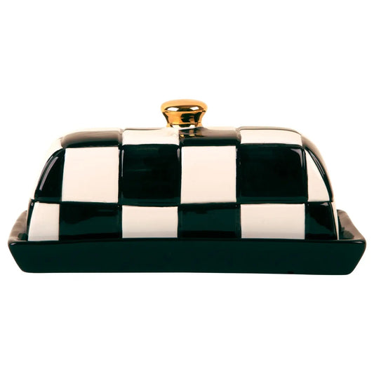 Black and white checkered ceramic butter dish with a solid black base and gold-tone knob. A playful, polished addition to the kitchen or table.