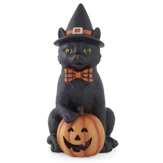 A resin figurine of a black cat wearing a witch hat, sitting next to a LED-powered Jack-O-Lantern.