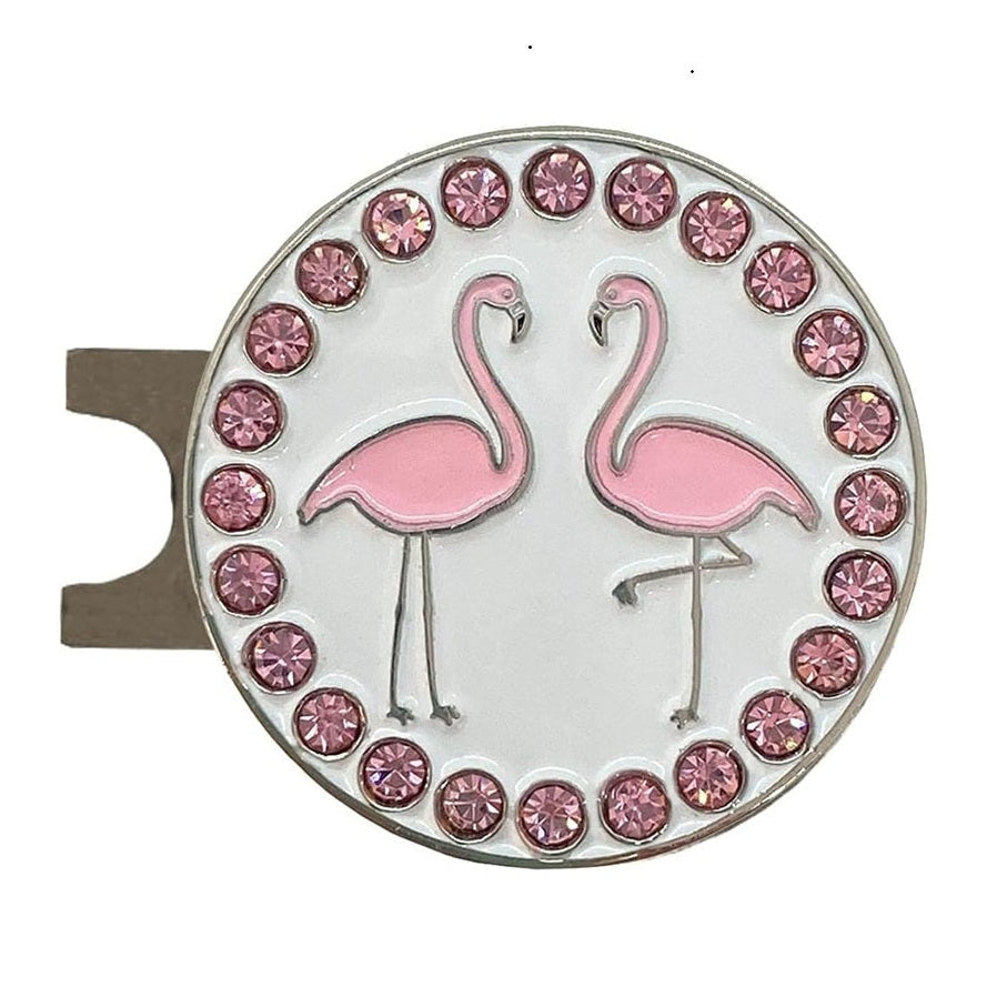 Round golf ball marker and hat clip with pink flamingo design and gemstone border on a white background