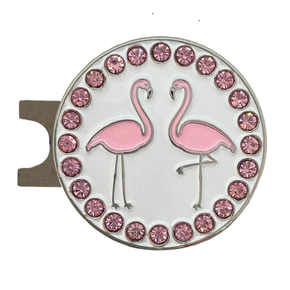Round golf ball marker and hat clip with pink flamingo design and gemstone border on a white background