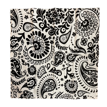 A square fabric item, a napkin, featuring a black and white paisley pattern, laid flat on a white background.