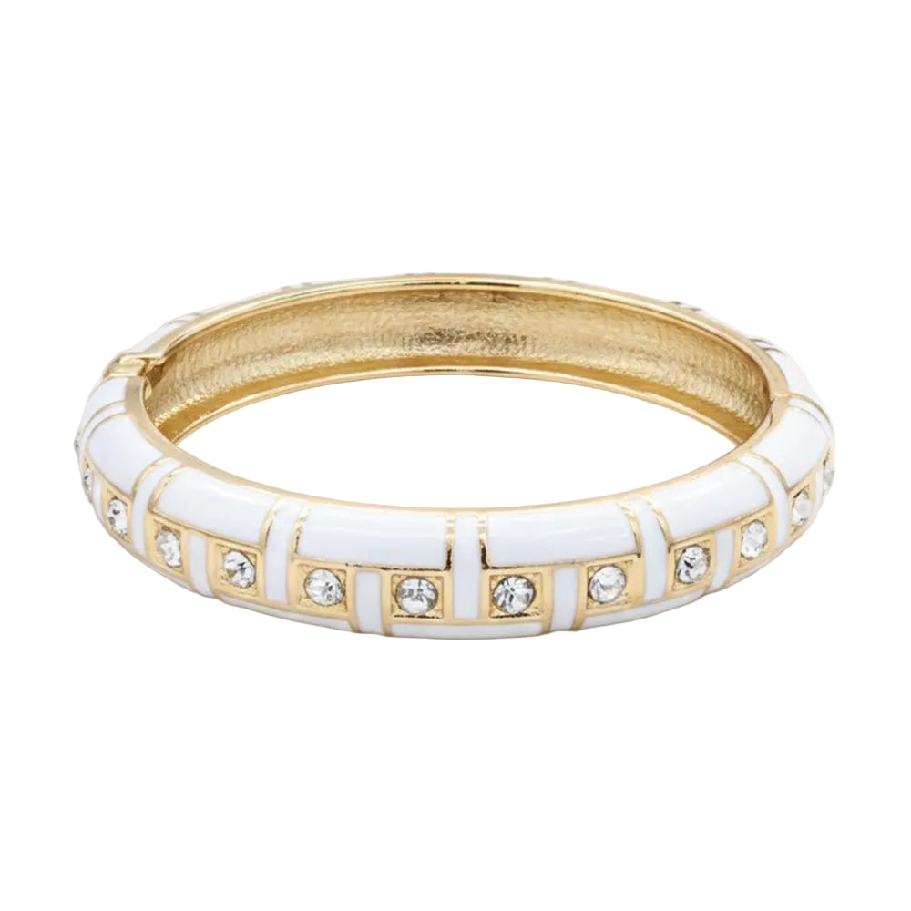 Gold and white bracelet with gemstones on a white background