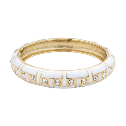 Gold and white bracelet with gemstones on a white background