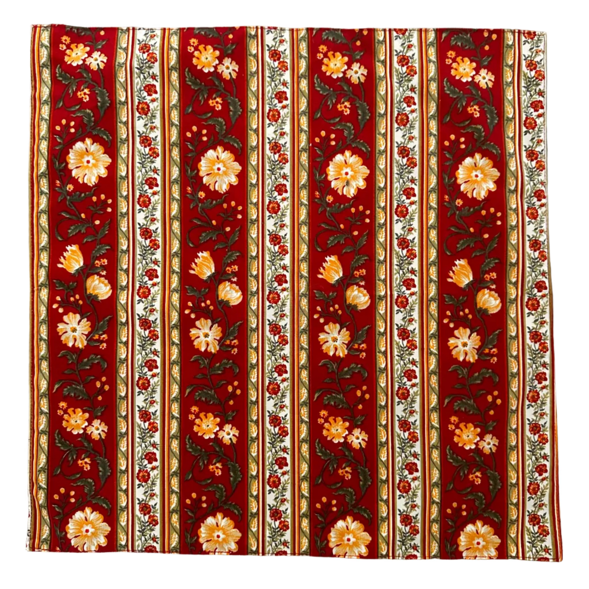 A square napkin with a vertical floral pattern in red, cream, orange, and green, laid flat on a white background.
