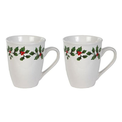 Two white mugs with holly design on a white background