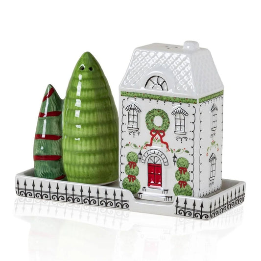 Ceramic house with green trees salt and pepper shakers  on a white background