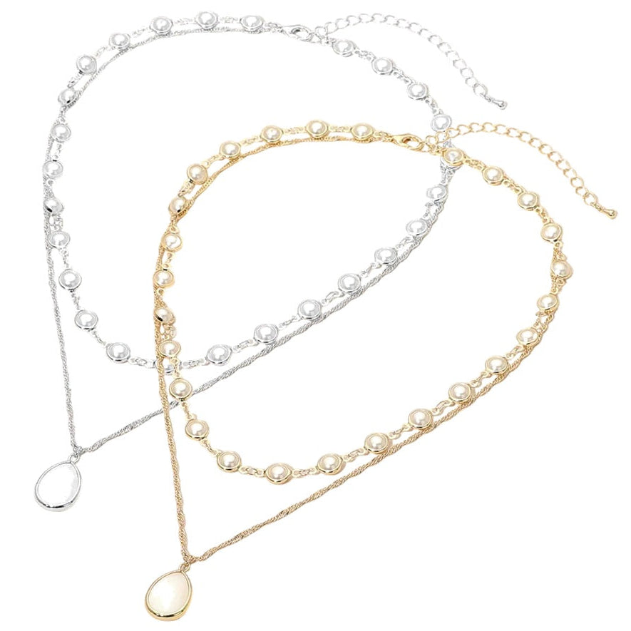 Two pearl necklaces in gold, silver, and white on a white background