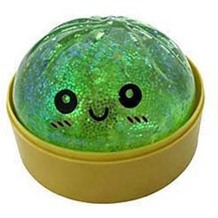 Green glowing ball with a face in a yellow container on a white background