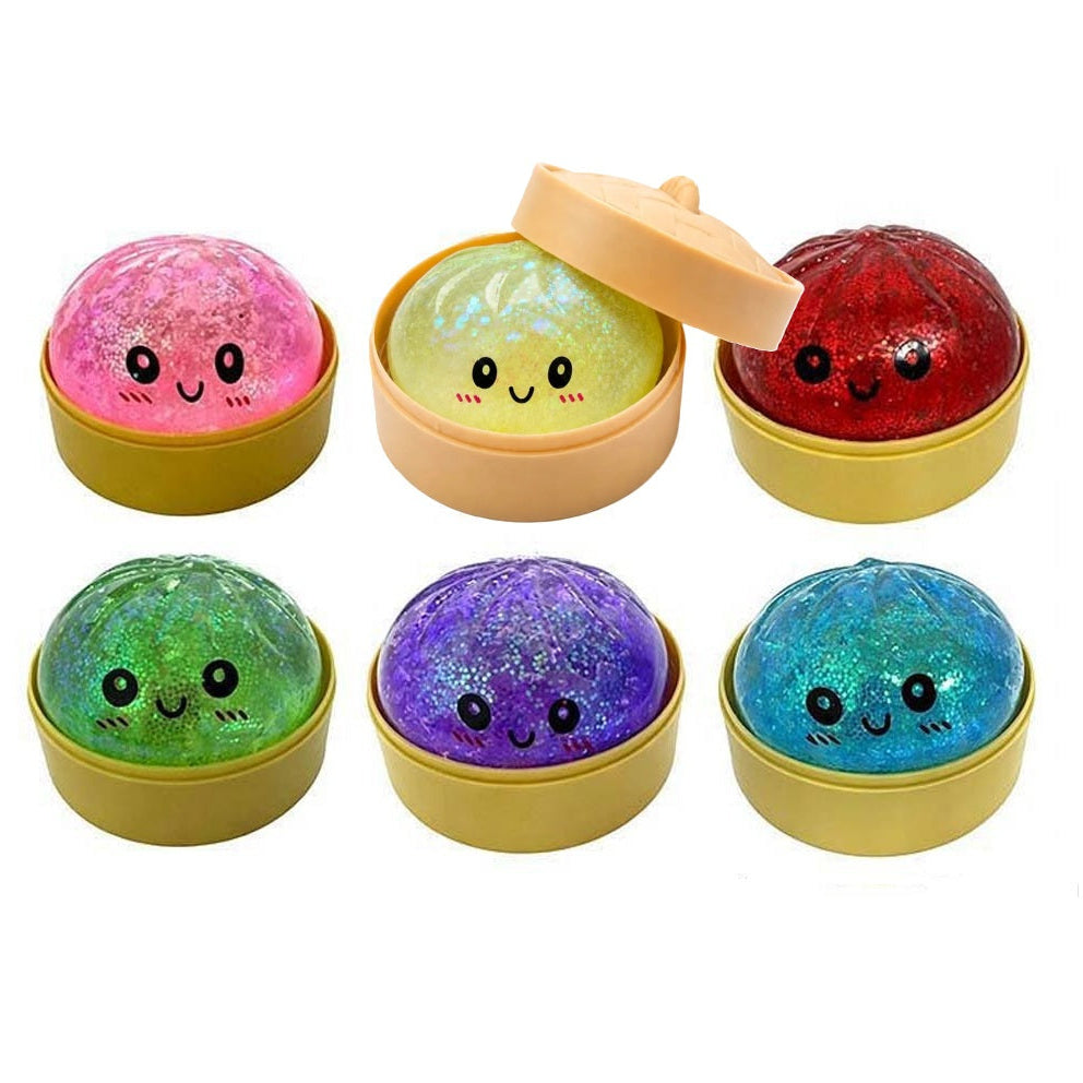 Set of colorful dumpling squishy toys with faces in yellow containers on a white background