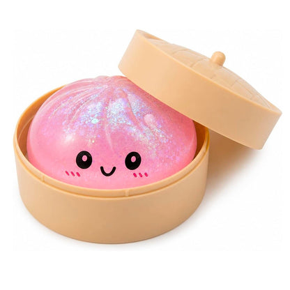 Pink dumpling with a smiley face in a beige container on a white background
