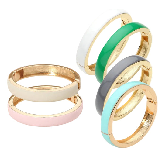 Set of colorful rings with gold bands on a white background