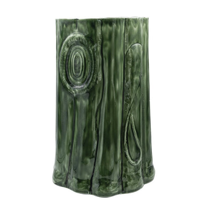 Green enameled metal log-shaped table and stool with sculpted bark, knot, and wood-grain details.