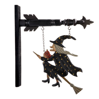 A decorative arrow replacement sign featuring a flying witch with a broomstick, primarily in black color with details in orange and white, designed for seasonal or holiday decoration.