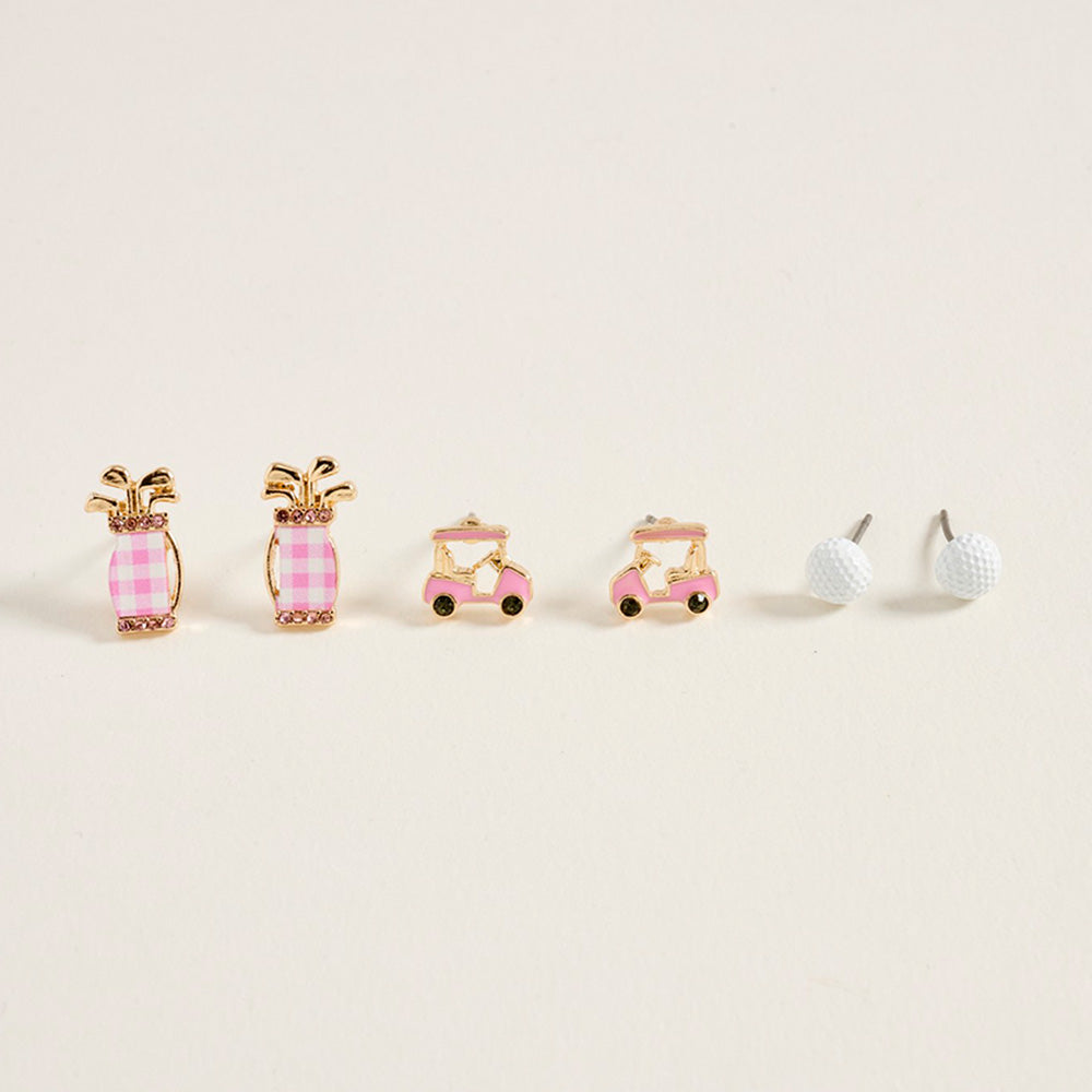 Set of three earrings shaped like a golf bag, cart, and ball on a beige background