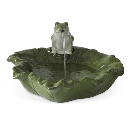 A decorative fountain with a frog perched on a leaf-shaped basin, shown on a plain white background.