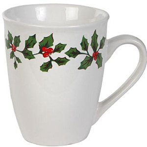 A white ceramic dinner mug with holly and berries design around the outer edge.